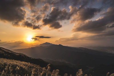 Scenic view of mountains against sky during sunset