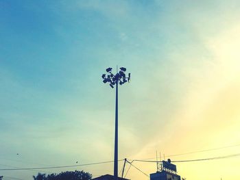 Low angle view of floodlight against sky