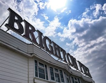 Low angle view of building against cloudy sky