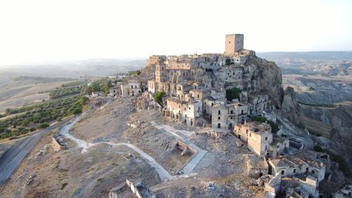 Panoramic view of castle on mountain against sky