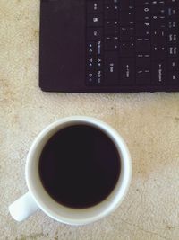 Close-up of coffee cup on table