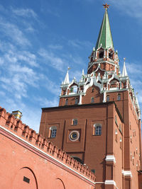 Low angle view of building against cloudy sky