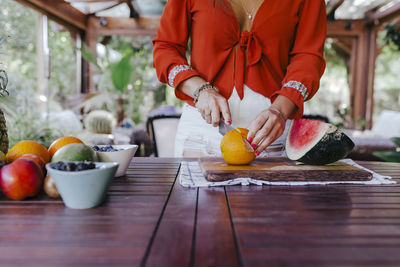 High angle view of orange fruits in bowl on table