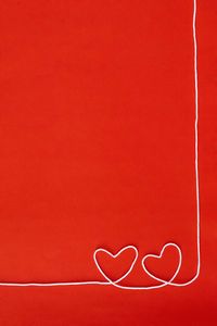 Close-up of heart shape on red wall