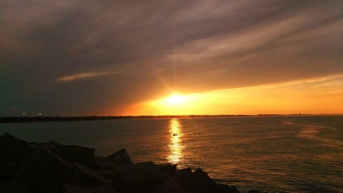 Scenic view of sea at sunset