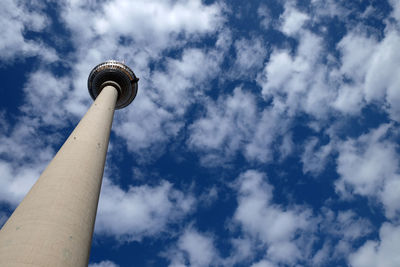 Low angle view of tower against cloudy sky