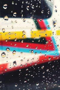 Full frame shot of wet glass window in rainy season