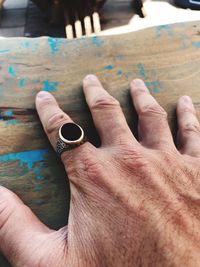 Close-up of hand on table