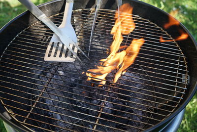 High angle view of meat on barbecue grill