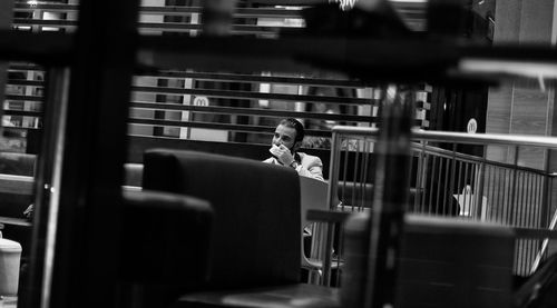 Woman photographing through window