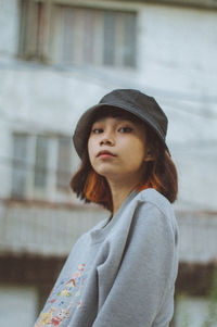 Portrait of young woman looking away