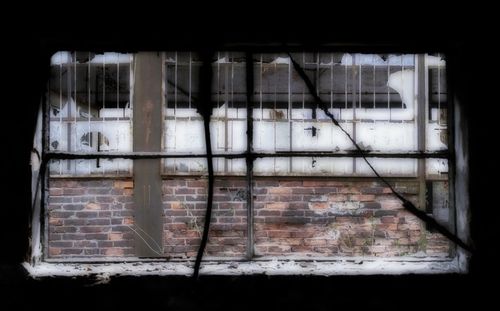 Broken glass window of abandoned building