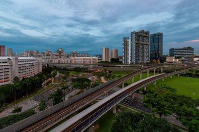 High angle view of street amidst buildings in city against sky