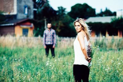 Woman standing on field
