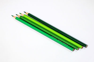 Close-up of colored pencils against white background