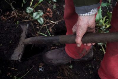 Low section of woman standing on tiled floor