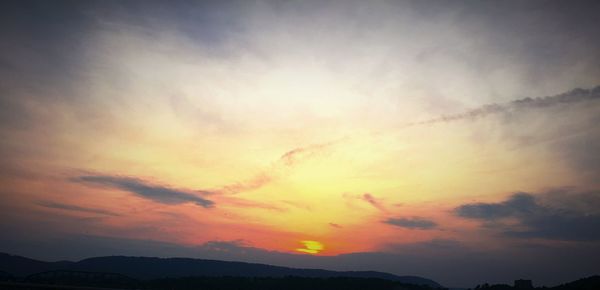 Low angle view of cloudy sky during sunset