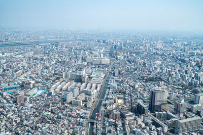 High angle view of city buildings against sky