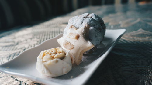 Close-up of cookies in plate on table at home