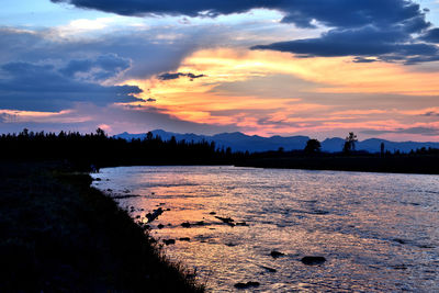 Scenic view of silhouette land against sky during sunset