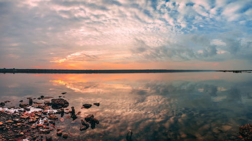 Scenic view of sea against sky at sunset
