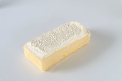 Close-up of cake against white background
