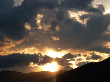 Scenic view of mountains against sky during sunset