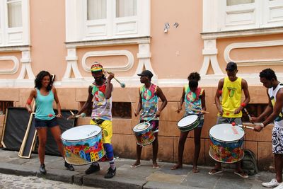 Group of people playing guitar in city