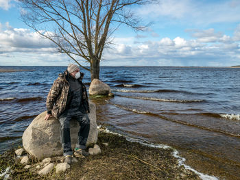 Man on beach against sky