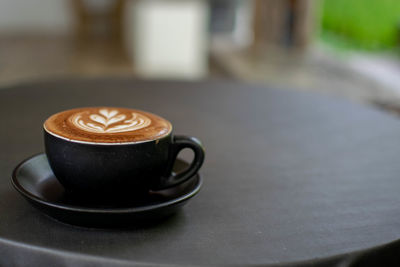 Coffee cup on table