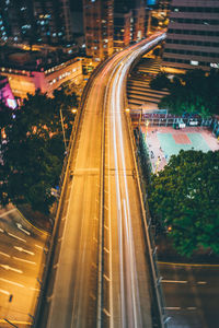 High angle view of light trails on road at night