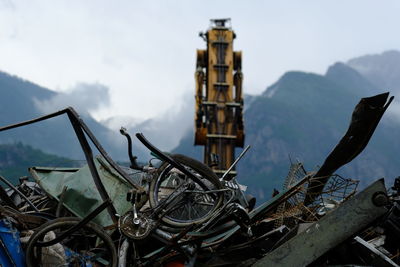 Old rusty wheel against sky
