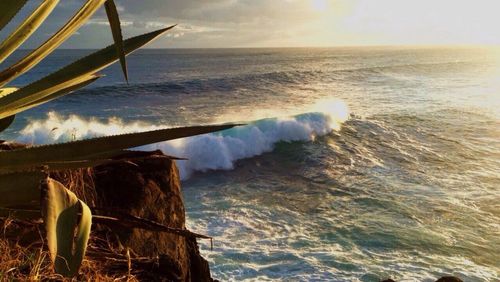 Scenic view of sea against sky during sunset