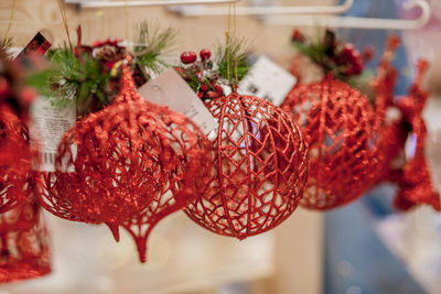 Close-up of christmas decorations hanging on table