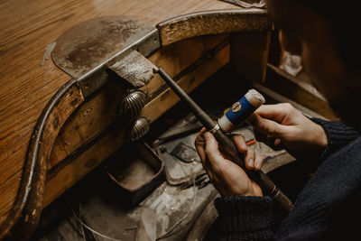 High angle view of hands working