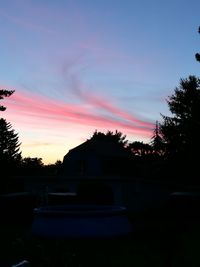 Silhouette of trees against sky at sunset