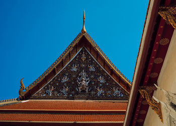 Low angle view of traditional building against clear blue sky