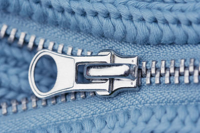 Close-up of zip on blue cloth