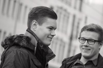 Close-up of smiling boy in city