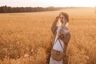 Young woman standing on field