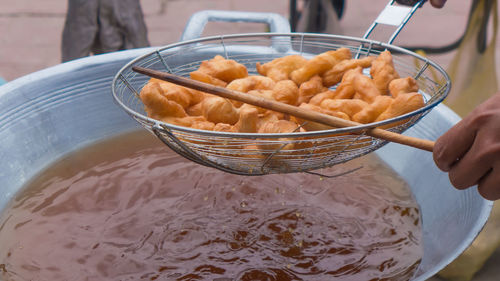 Close-up of person preparing food