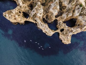 Aerial view of coastline by sea