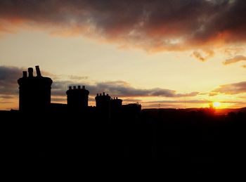 Silhouette of building at sunset