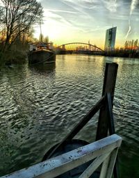 Bridge over river with buildings in background