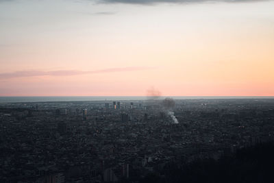 High angle view of city against sky during sunset