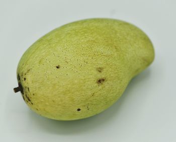 Close-up of lemon against white background