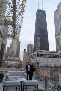 Modern buildings in city against sky