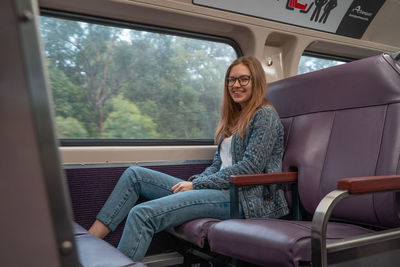 Woman sitting in bus