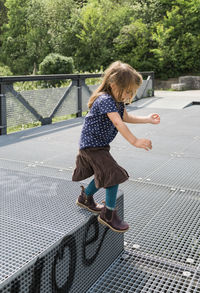 Full length of girl jumping outdoors