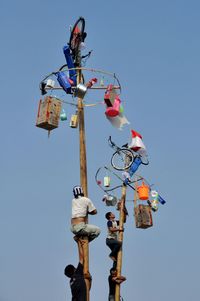 Low angle view of lamp post against clear blue sky